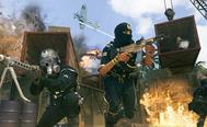 Image showing Vanguard players shooting in front of shipping containers
